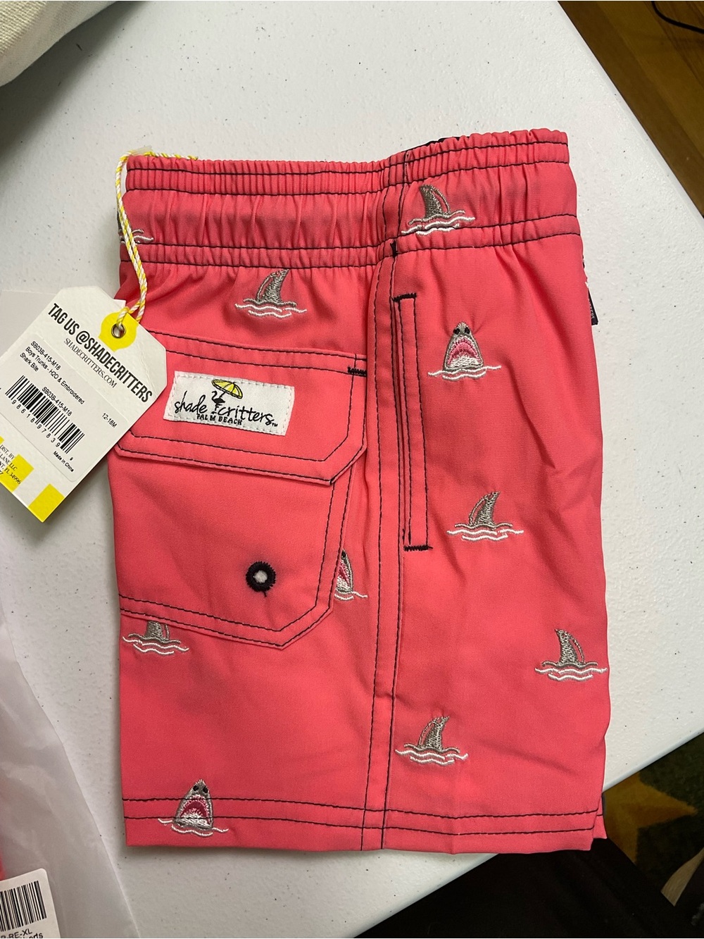 Shark Bite Boys 4 Way Stretch Water Appearing Embroidered Swim Trunks - Coral